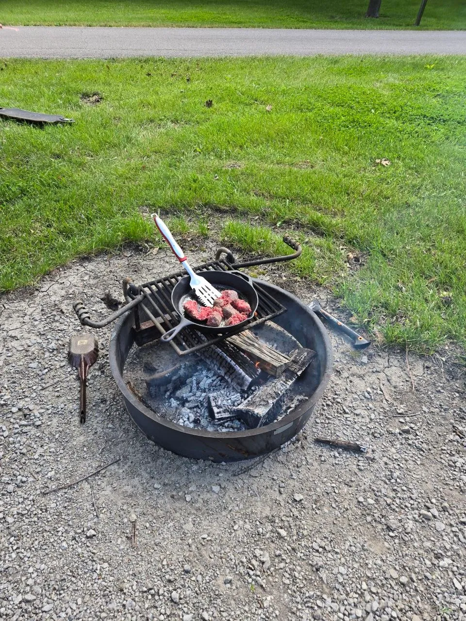 Cast-iron skillet meal cooking over coals at Rathbun Lake.